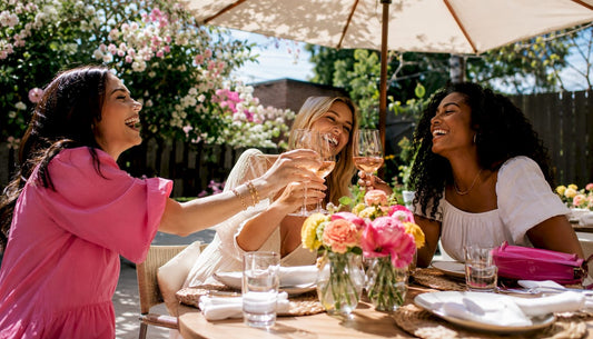 Women enjoying wine at outdoor bar