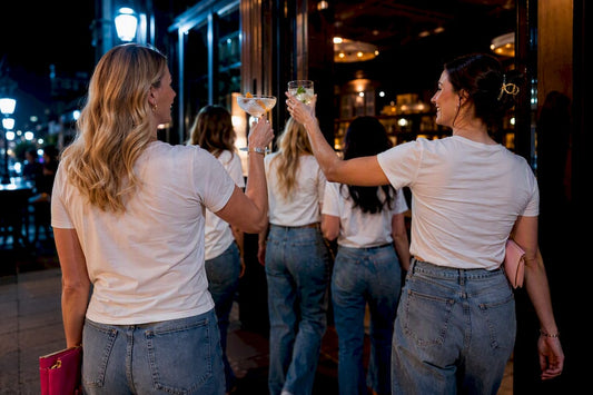 Bachelorette group entering a warmly lit bar