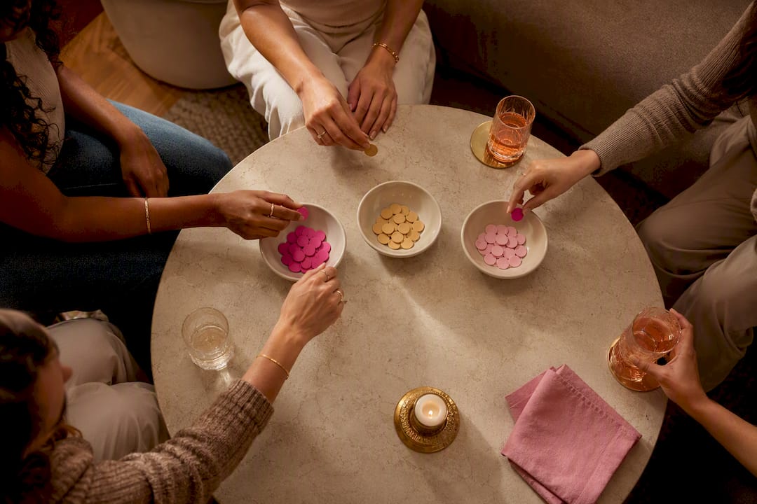Friends voting on a girls night theme