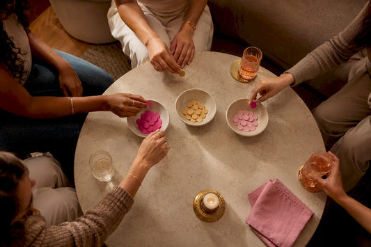 Friends voting on a girls night theme