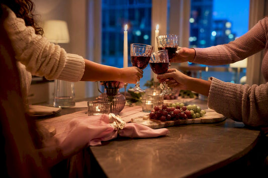 Friends raise wine glasses at themed tasting